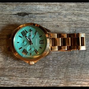 Rose gold Fossil watch with blue face